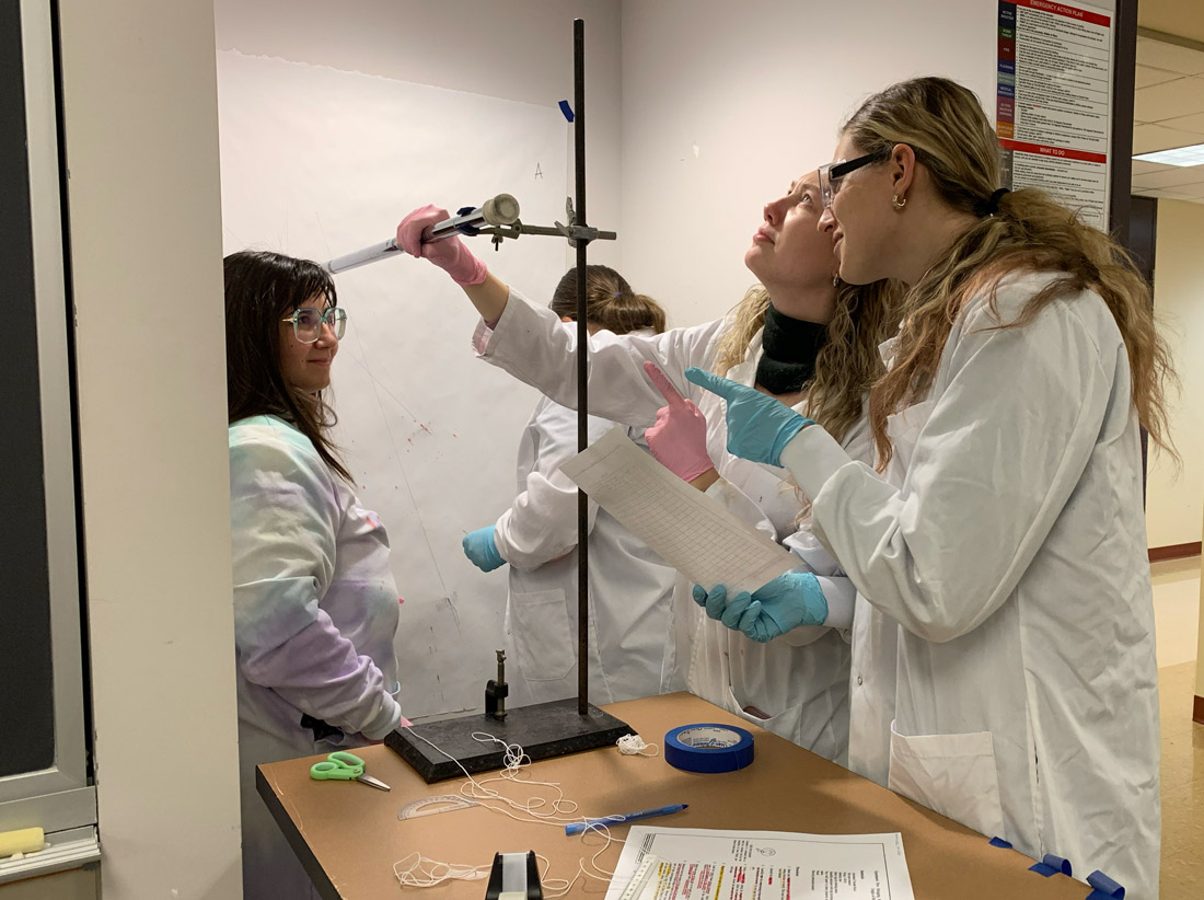 Forensic Science students calculating impact angles of bloodstains