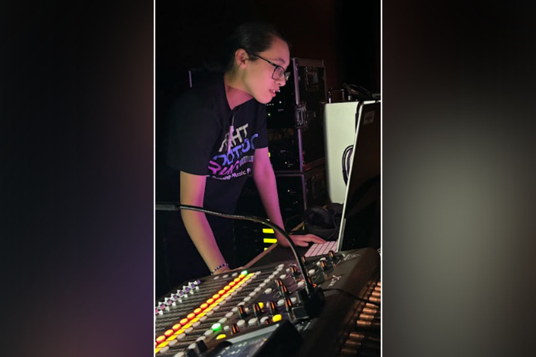 Photo of a Student Working on the Sound Board
