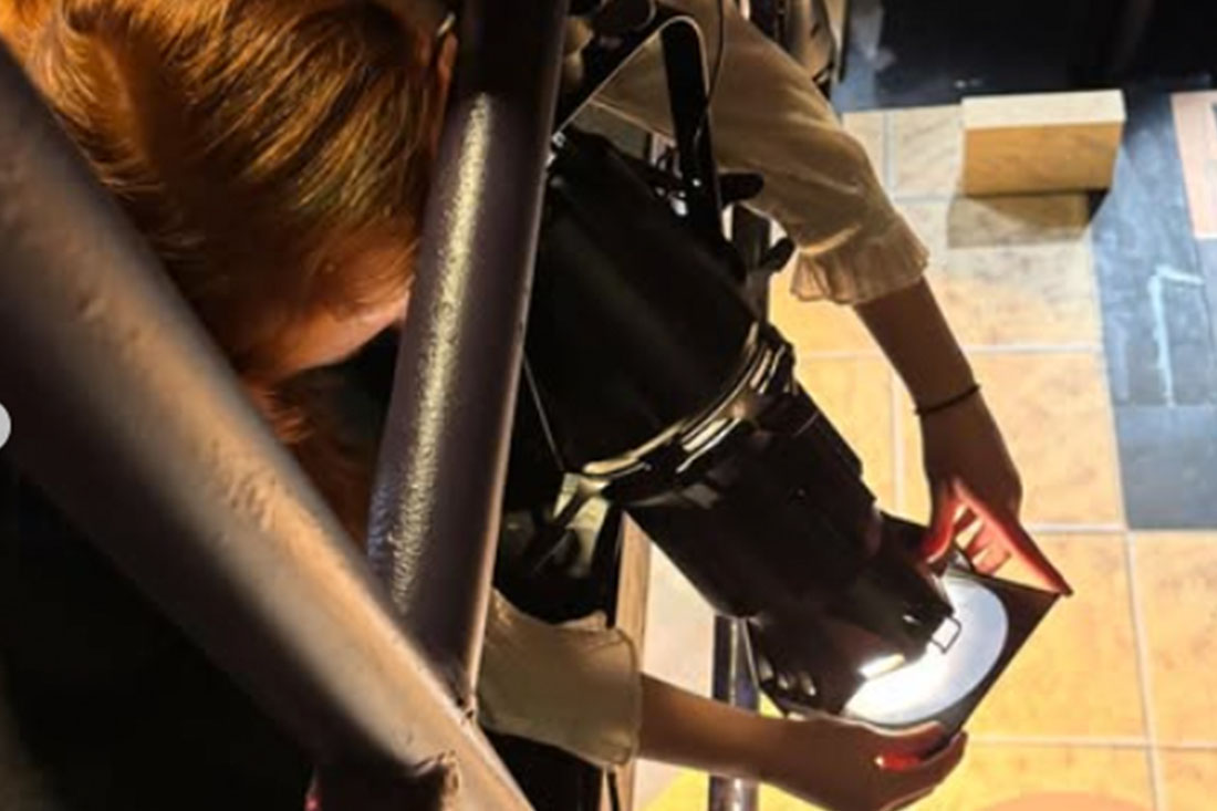 Photo of a Student Focusing Lights for Lysistrata