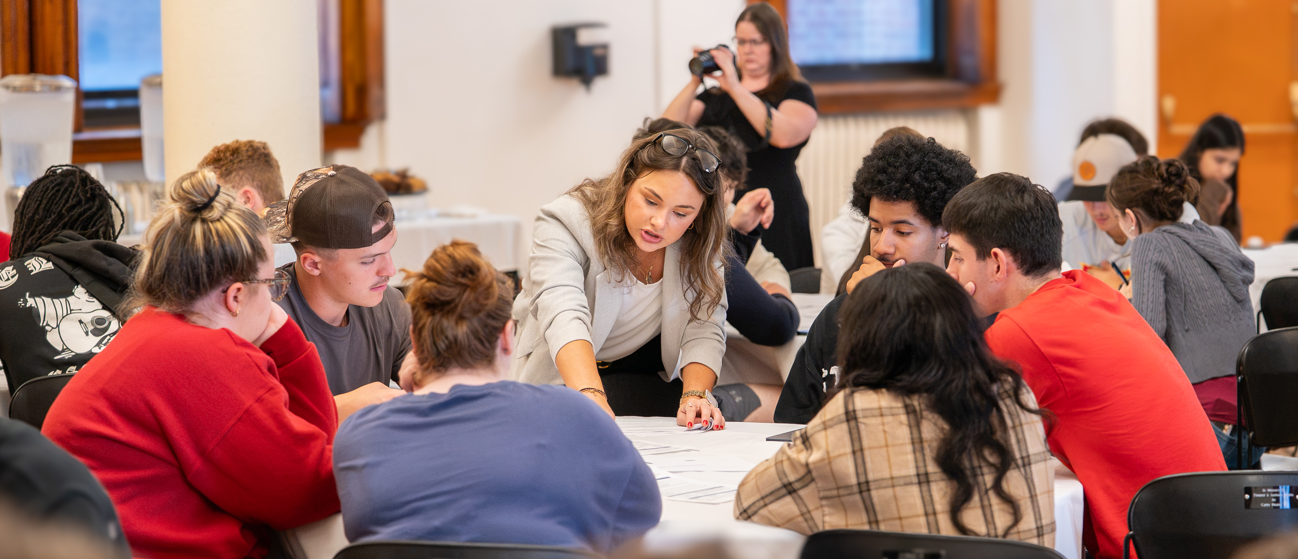 A KPMG representative works with Seton Hill University students on a case study presented in the workshop.