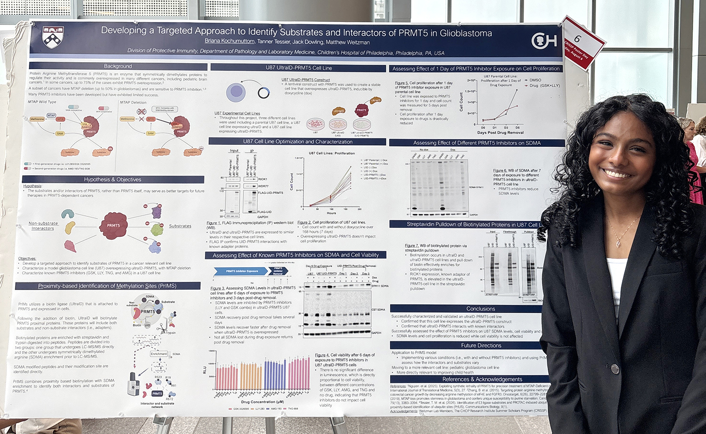 Briana Kochumuttom with a poster detailing her research at children's hospital of philadelphia