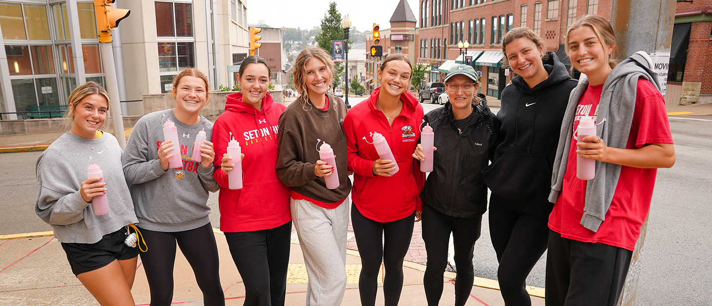 Seton Hill Women's Basketball Team participating in the Red Sand Project.