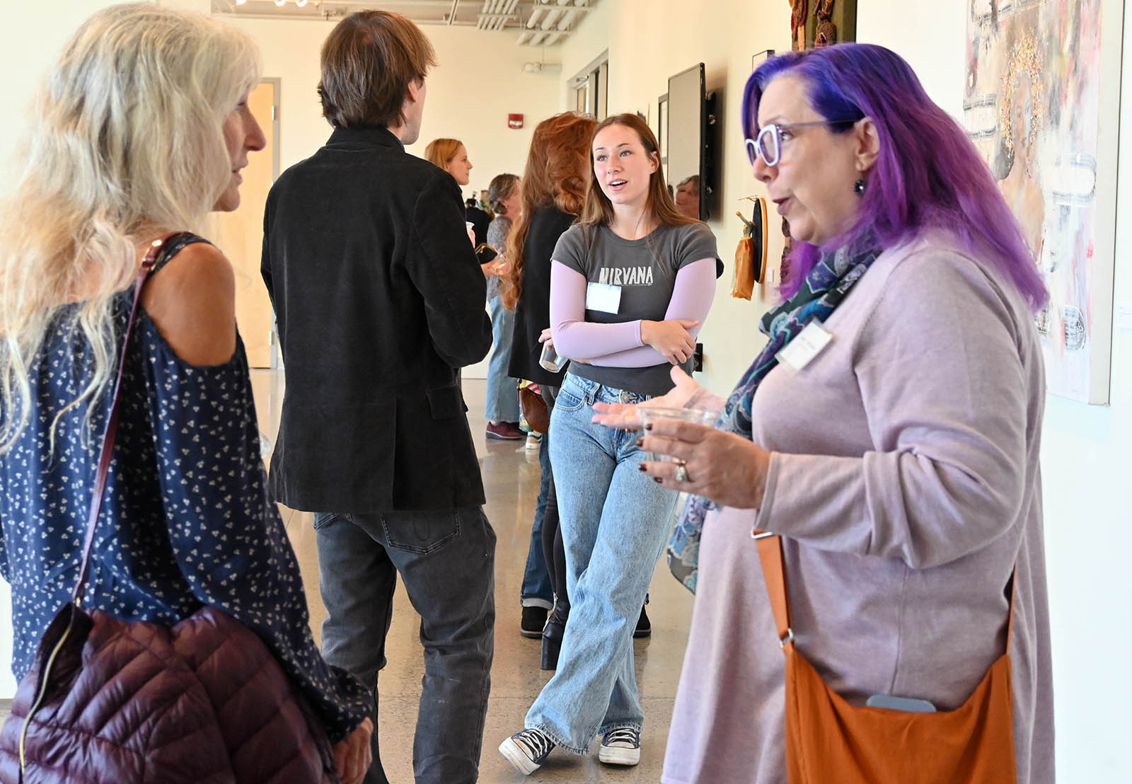 artists gathering and talking in Harlan Gallery