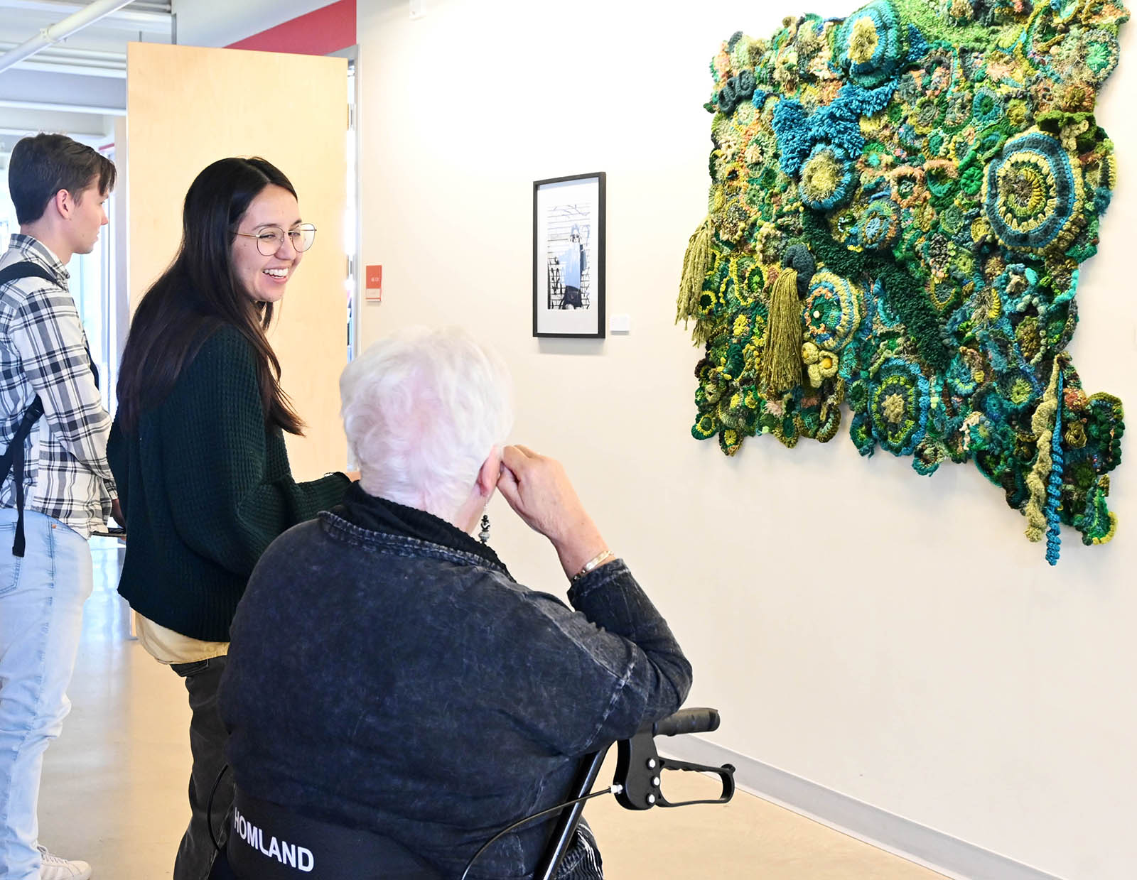 visitors discuss the art outside of Harlan Gallery